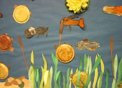 Student artwork of fish and sea turtles in their habitat